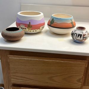 Four hand painted pots